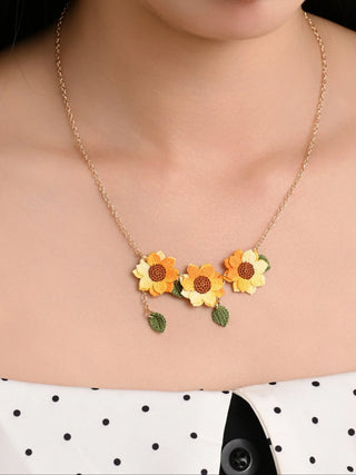 Handmade crochet sunflower necklace with gold chain and leaf charms