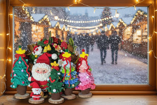 Handmade crochet Christmas decorations, Santa and trees, by a snowy window with festive lights