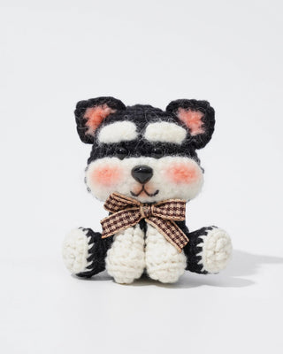 Handmade crochet amigurumi dog plush with bow tie, black and white, blush cheeks