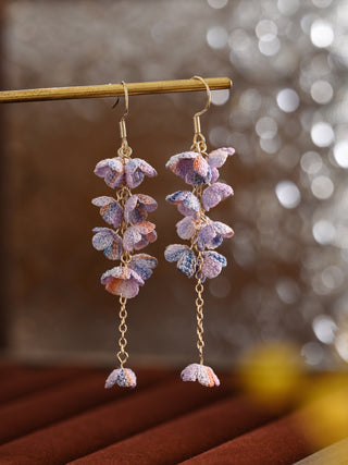 Pair of floral earrings with a blurred background