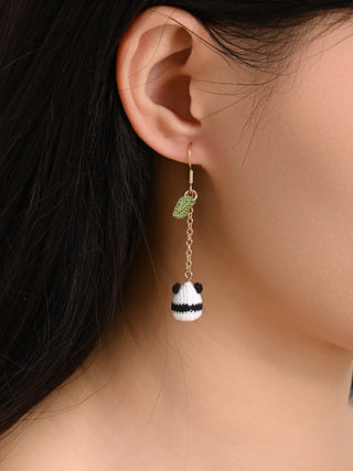 Earring worn by a person with a neutral background
