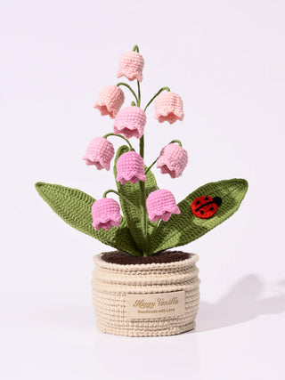 Handmade crochet lily of the valley with pink flowers and ladybird in crochet pot
