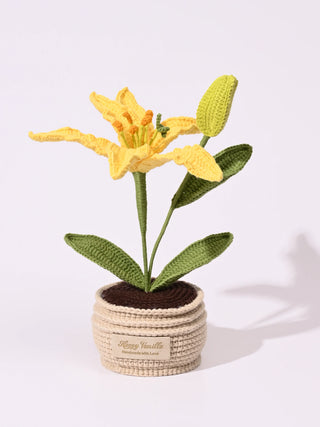 Handmade crochet yellow lily flower in a beige crochet pot with green leaves