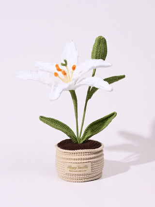 Handmade crochet white lily flower in a beige pot with green leaves and bud