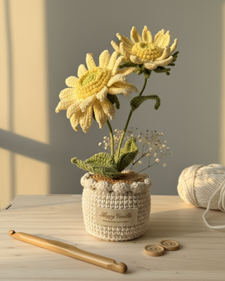 Handmade crochet sunflower bouquet in a crochet pot with crochet hook and yarn on wooden table